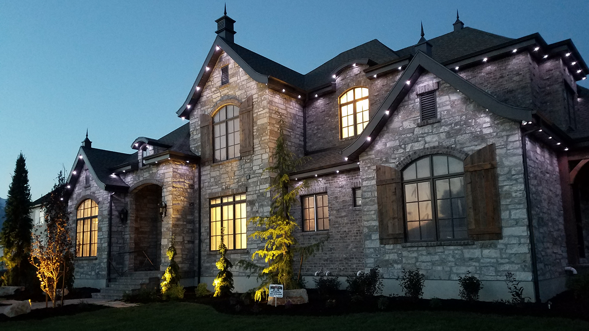 Forever Lights installed home at twilight